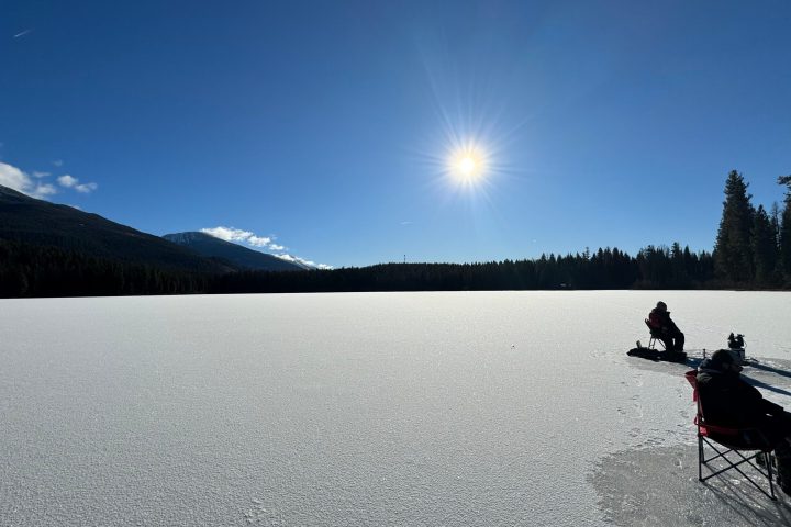 a person riding skis down a snow covered mountain