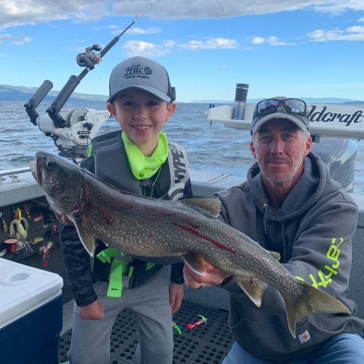 a man holding a fish