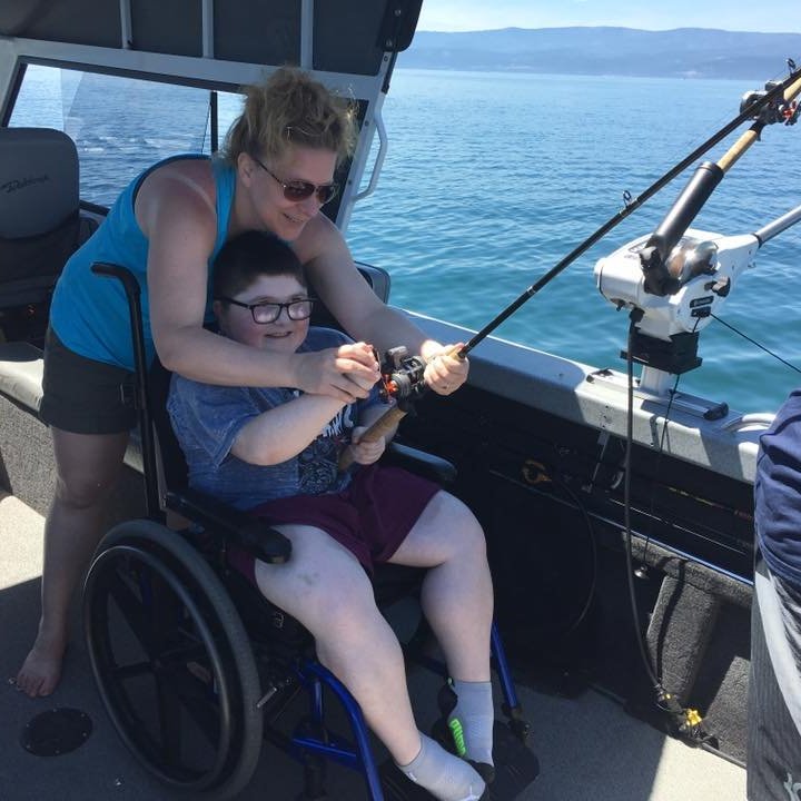 a woman sitting on a boat in the water