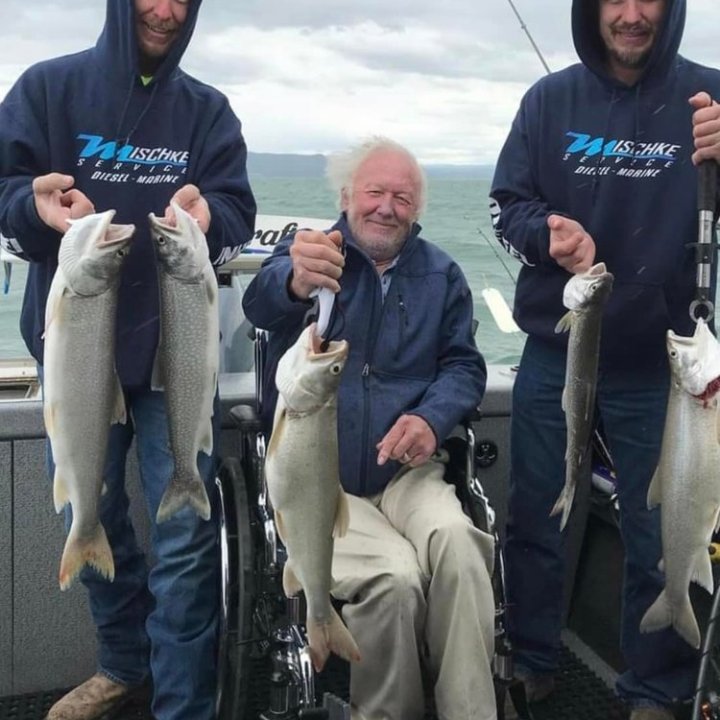 a man holding a fish