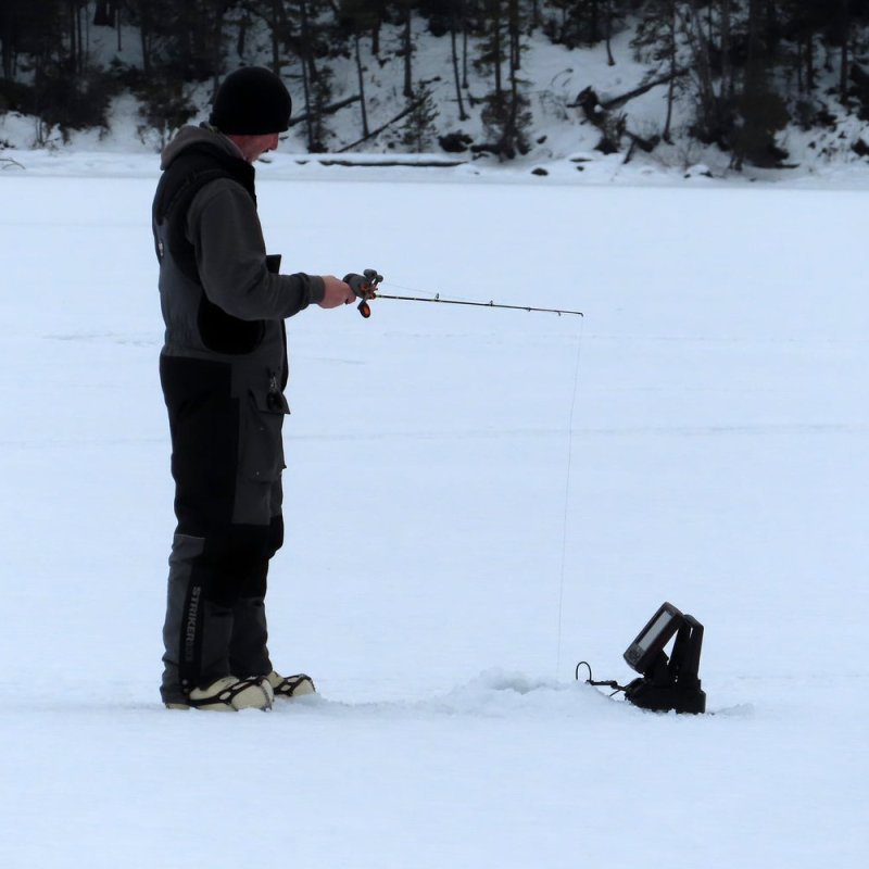 a man that is standing in the snow