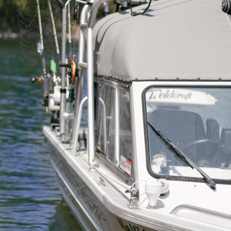 a boat sitting on top of a car