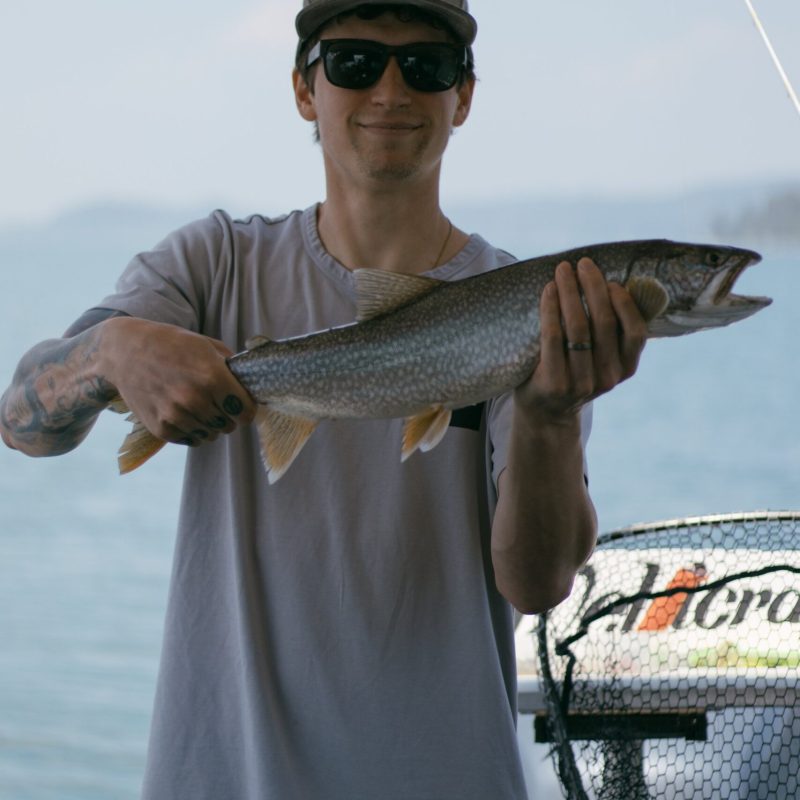 a man holding a fish