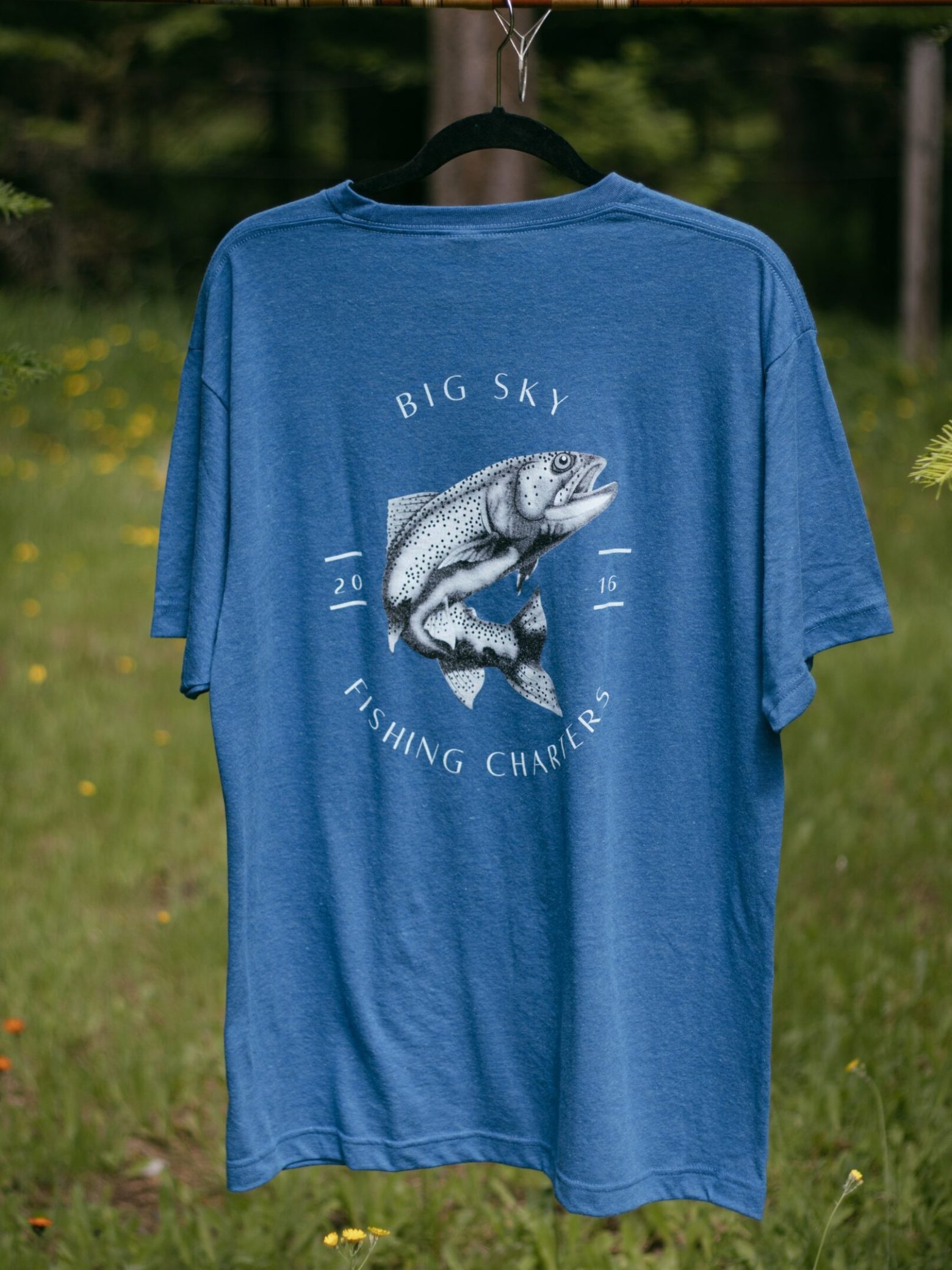 a little boy wearing a blue shirt