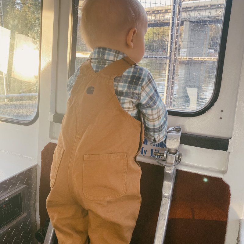 a man standing in front of a window